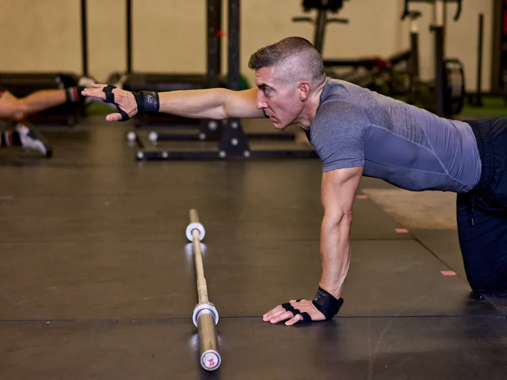 An athlete practicing proper movement form and technique during a 1-on-1 coaching session at ESTLR Athletics.