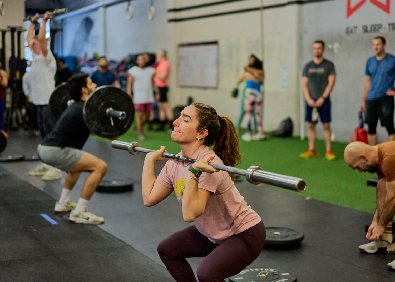 What is MetCon | Member performing a front squat during CrossFit class at ESTLR gym